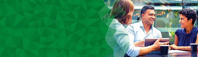 Three workers enjoying some quality light banter halfway through a meeting